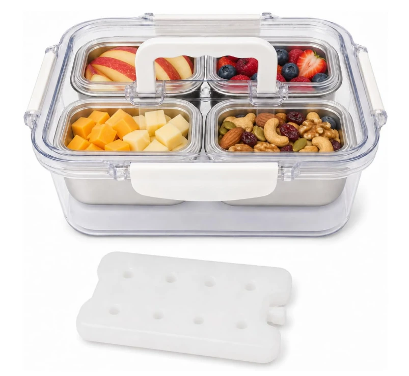 Clear four-compartment snack box filled with fruit, cheese and nuts, with its removable ice pack